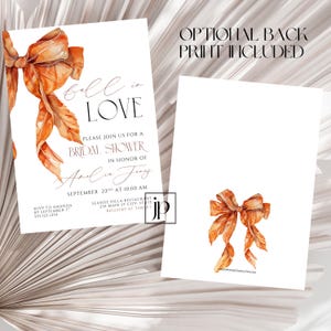 May include: A white bridal shower invitation card featuring a watercolor orange ribbon bow and black text that reads Fall in LOVE, PLEASE JOIN US FOR A BRIDAL SHOWER IN HONOR OF Amelia Jones, SEPTEMBER 22ND AT 10:00 AM. Includes an optional back print.