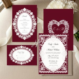 May include: A set of deep burgundy wedding stationery featuring white lace-style borders. The cards include a main invitation, a details card, and a reply card, all displaying white text with elegant script and serif fonts on a dark red background.