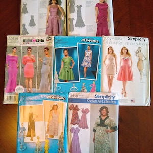 May include: A collection of Simplicity and Mimi G Style sewing patterns for dresses. The patterns feature various dress styles, including princess seams, two-piece designs, and Project Runway collections. The covers showcase images of the finished garments.