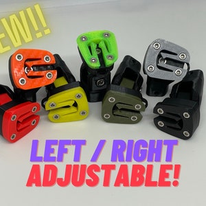 May include: Set of seven adjustable foot pegs in various colors, including red, orange, yellow, green, gray, and black. The pegs are designed for motorcycles and feature a left/right adjustable design.