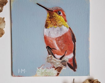 Handmade oil painting of an orange hummingbird