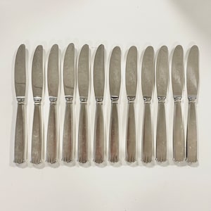 Vintage Danish set of 12 mid century modern knives with beautiful pattern designed by Lundtofte and Raadvad, Denmark