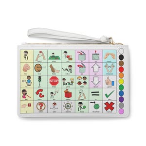 May include: White clutch with a wrist strap and a zipper closure. The front features a grid of colorful communication symbols and words. A color palette is on the right side.