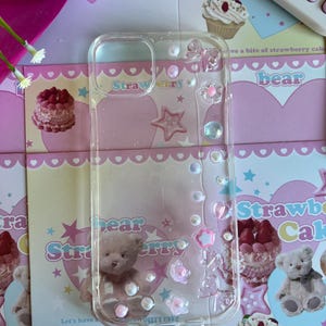 パールとリボンのアクセントが付いたかわいいチャーム樹脂製電話ケース、かわいいグリッターiPhoneアクセサリー、Kポップフォトカードホルダー、カスタム電話ケース