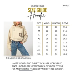 May include: Size chart for a Gildan 18500 hoodie in inches. The chart shows the width, length, and sleeve length for sizes S through 5XL. The model is wearing a size XL.