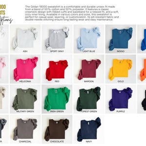 May include: A chart showing 18 different color options for Gildan 18000 sweatshirts. The colors include white, ash, sport gray, light blue, indigo, royal, light pink, heliconia, red, maroon, gold, orange, sand, military green, Irish green, forest green, purple, black, dark heather, charcoal, chocolate, and navy.