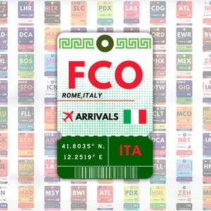 May include: A luggage tag design featuring the airport code FCO for Rome, Italy, in large red letters. The tag includes the word "ARRIVALS", the Italian flag, and coordinates 41.8035° N, 12.2519° E. Other airport tags are in the background.