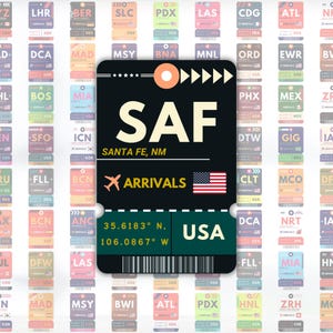 May include: A black and green luggage tag design with the text "SAF SANTA FE, NM ARRIVALS USA" and the American flag. The tag includes coordinates and is surrounded by other airport tags.