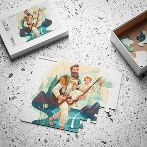 May include: A completed jigsaw puzzle with an illustration of a man carrying a child, both holding fishing poles. The puzzle is partially assembled, with a box and some loose pieces visible. The text "spirituallycatholic.etsy.com" is printed on the puzzle.