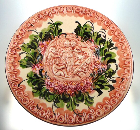 Early 20th Century Spanish Terracotta Relief Plate with Children Playing and Floral Pattern