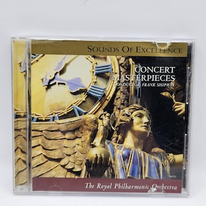May include: A CD case with the title "Sounds of Excellence" and "Concert Masterpieces" by Frank Shipway. The cover art shows a clock face and a statue with blue and gold details. The Royal Philharmonic Orchestra is also listed.