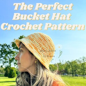 May include: A crocheted bucket hat in a yellow and orange color scheme. The hat is worn by a person with long brown hair. The text "The Perfect Bucket Hat Crochet Pattern" is at the top of the image. The text "Easy Knits by Karen" is at the bottom of the image.