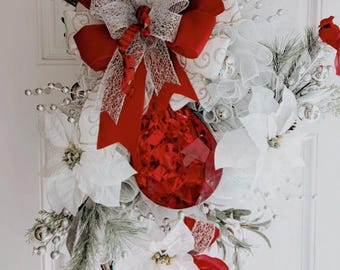 Silver and red Christmas swag, white poinsettia, red jewel