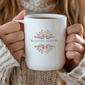 May include: White ceramic mug with a floral design and the text "Blessing Season Galatians 6:9".