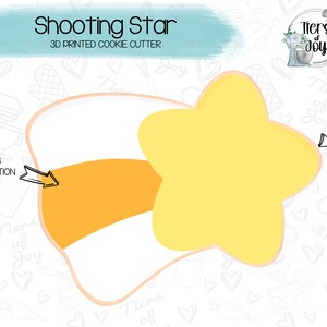 May include: A 3D printed cookie cutter in the shape of a shooting star with a yellow star and an orange stripe. The cutter is on a white background with a pattern of hearts, mixers, and other baking-related items.
