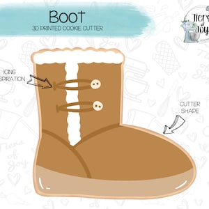 May include: A 3D printed cookie cutter in the shape of a brown boot with white fur trim. The cutter is designed to create cookies that look like a winter boot.