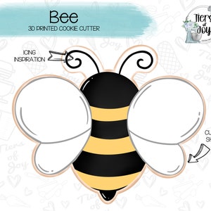 May include: A 3D printed cookie cutter in the shape of a bee. The bee is yellow and black with wings. The cutter is designed for use with cookie dough.