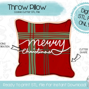 Pode incluir: Um arquivo STL para download digital para um cortador de biscoitos em forma de almofada de xadrez vermelho e verde com o texto "merry christmas" nele.