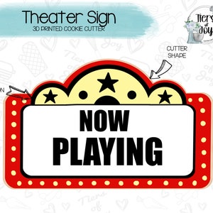 May include: A red and yellow 3D printed cookie cutter shaped like a movie theater marquee sign with the words "NOW PLAYING" in black text.
