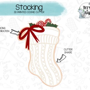 May include: A 3D printed cookie cutter in the shape of a white stocking with a red bow and candy canes. The cutter is designed for making Christmas cookies.