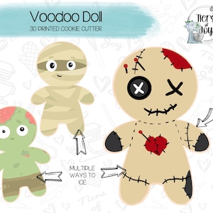 May include: A set of three 3D printed cookie cutters shaped like voodoo dolls. The cutters are in the shape of a mummy, a zombie, and a traditional voodoo doll with a red heart and stitches. The text "Voodoo Doll" and "3D Printed Cookie Cutter" is at the top of the image.