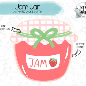 May include: A 3D printed cookie cutter shaped like a jar of jam. The jar is red with a pink and white checkered lid and a green bow. The label on the jar says "JAM" and has a red strawberry on it.