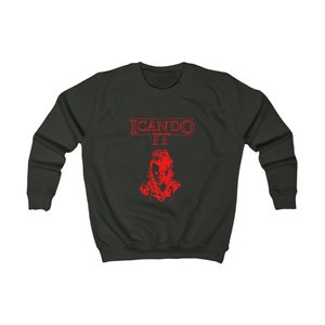 May include: Dark green sweatshirt featuring the red text "I CAN DO IT" and a red graphic of a person's face. The sweatshirt has a crew neck and long sleeves. The graphic is a stylized portrait.