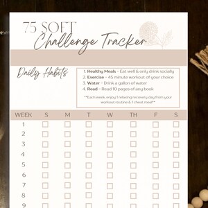 May include: A printable 75-day challenge tracker with a beige background. The tracker includes a checklist for daily habits such as healthy meals, exercise, water intake, and reading. The tracker is divided into weeks and days of the week, with checkboxes for each day.