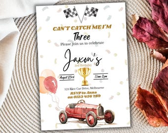 May include: A birthday party invitation with a red race car, checkered flags, and balloons. The invitation says "Can't Catch Me I'm Three" and "Jaxon's 3rd Birthday".