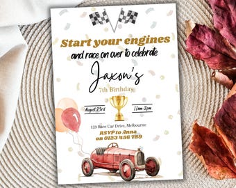 May include: A white invitation with gold text and confetti. The invitation is for Jaxon's 7th birthday party. The party is themed around racing cars and includes a red race car with balloons. The text on the invitation reads "Start your engines and race on over to celebrate Jaxon's 7th Birthday. August 23rd 11am-2pm 123 Race Car Drive, Melbourne RSVP to Anna on 0123 456 789"