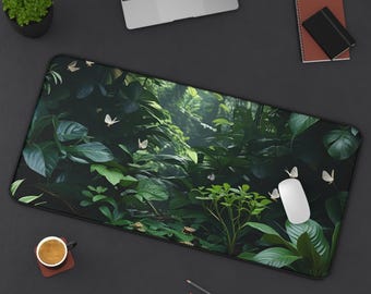 May include: A rectangular mousepad featuring a lush green jungle scene with white butterflies. The mousepad is surrounded by a black border. A white computer mouse rests on the pad, alongside a laptop, coffee cup, and stationery.