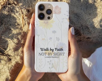 May include: White phone case with a floral design and the text "Walk by Faith NOT BY SIGHT 2 Corinthians 5:7". The case features a pastel flower pattern in yellow, pink, and purple.