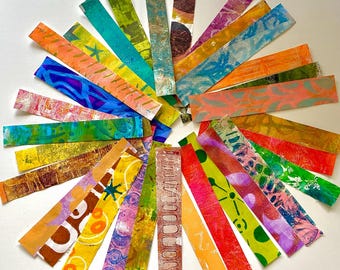 May include: A circular arrangement of rectangular art pieces, each displaying a unique pattern and colour. The pieces feature a variety of hues, including orange, blue, green, purple, and brown. The artwork appears handmade, with visible textures and layered designs.