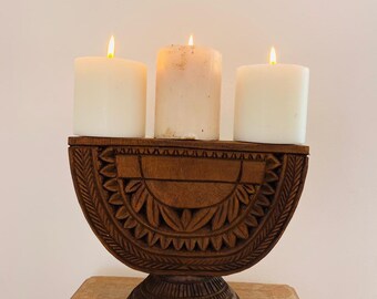 Wood carved candle.holder