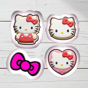 May include: Four Hello Kitty-themed cookie cutters. The designs include a full figure, a face, and a bow. The fourth cutter is a heart-shaped design with the character's face. Each cutter has a pink outline.