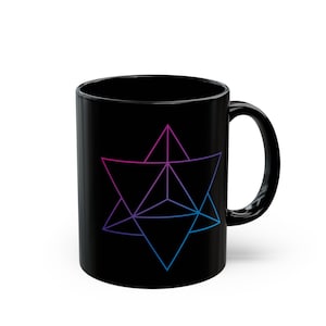 May include: Black ceramic coffee mug featuring a geometric design in shades of pink, purple, and blue. The design is a complex arrangement of intersecting lines and shapes. The mug has a standard handle.