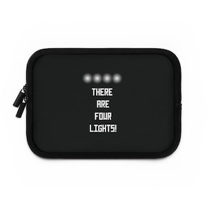May include: Black zippered pouch with a white graphic that reads "THERE ARE FOUR LIGHTS!" with four white circles above the text.
