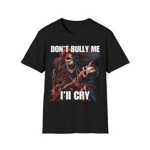 May include: Black t-shirt with a graphic of two skeletons, one embracing the other. The text "DON'T BULLY ME" is above the image, and "I'LL CRY" is below it, in white block letters.