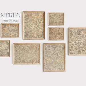 May include: A set of eight framed prints with a floral pattern in shades of beige, brown, and gray. The frames are a light wood color. The prints are arranged in a gallery wall style.