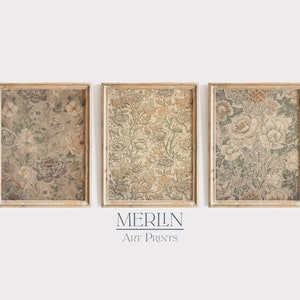 May include: Three framed prints with a floral pattern in shades of green, brown, and white. The frames are a light wood color. The prints are titled "MERLIN ART PRINTS".