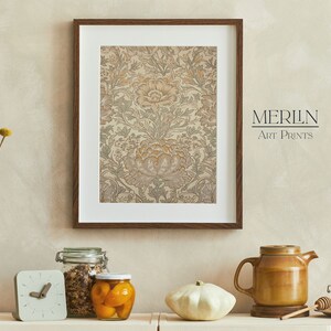 May include: A framed print of a floral pattern in shades of beige, brown, and green. The print is hanging on a beige wall. The text "MERLIN Art Prints" is visible in the bottom right corner of the image.