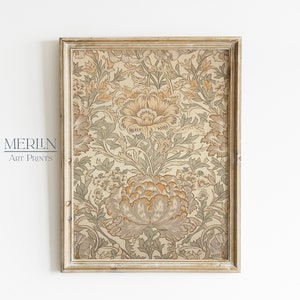 May include: A framed print with a vintage floral pattern in shades of beige, brown, and green. The frame is a light wood color with a distressed finish.