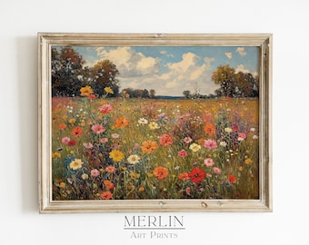 Op de afbeelding: Een ingelijst landschapsschilderij van een levendige weide met wilde bloemen onder een blauwe lucht met witte wolken. Het kunstwerk toont een verscheidenheid aan kleurrijke bloemen in tinten rood, roze, geel en oranje. De lijst is licht en neutraal van kleur. De tekst "MERLIN Art Prints" staat onderaan.
