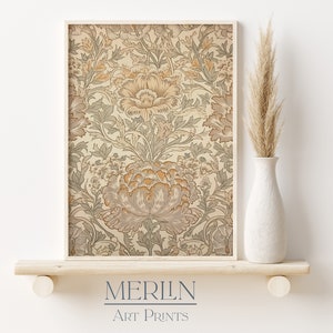 May include: A framed print of a vintage floral pattern in shades of beige, brown, and green. The print features a repeating pattern of stylized flowers and leaves. The frame is a simple, light wood color.