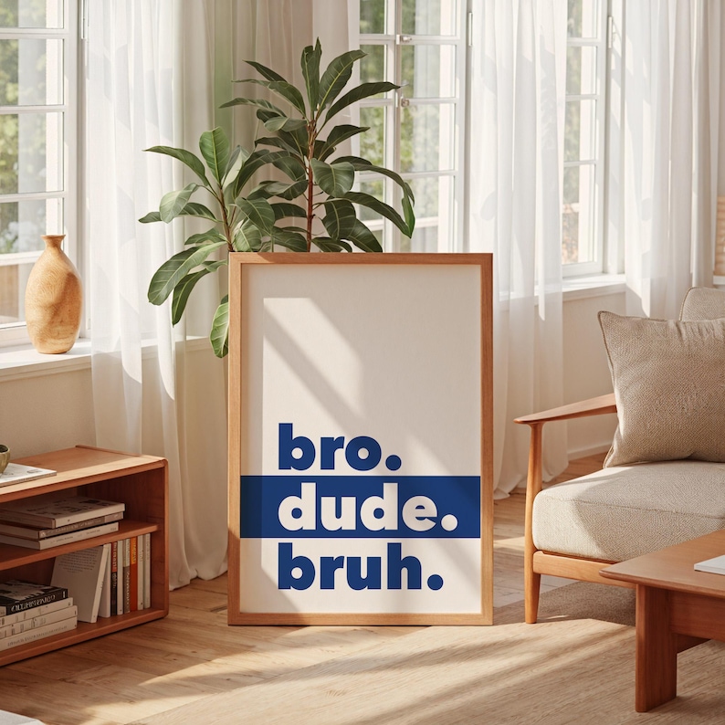 May include: A framed print with the words "bro. dude. bruh." in blue text on a white background.