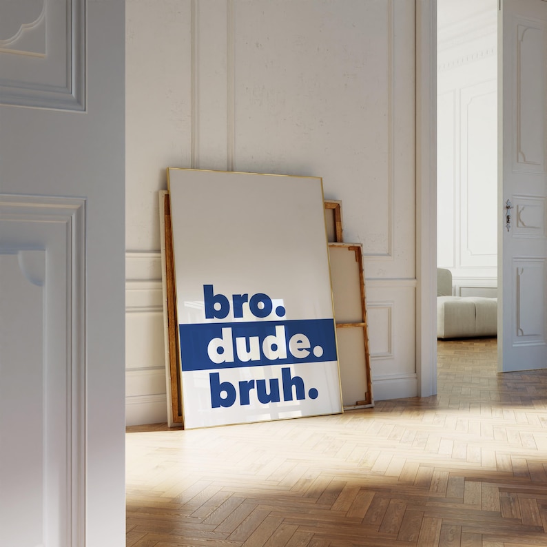 May include: A white framed poster with the words "bro. dude. bruh." in blue letters on a blue background.