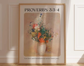 May include: A framed print with a quote from Proverbs 3:3-4, "Let love and faithfulness never leave you..." The print features a painting of a bouquet of colorful flowers in a white vase against a light pink background.