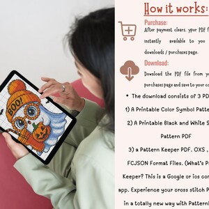 May include: A digital cross-stitch pattern displayed on a tablet. The design features a cartoon ghost wearing an orange hat with the word "BOO!" and holding a pumpkin. The image includes bats and the text "How it works".