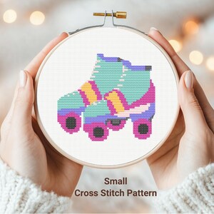 May include: A cross stitch pattern for a colorful roller skate. The skate is blue, pink, yellow, and white. The pattern is labeled "Small Cross Stitch Pattern".