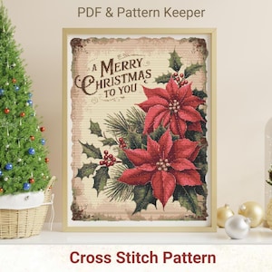 Puede incluir: Un patrón de punto de cruz con una tarjeta de Navidad de estilo vintage con el texto "A Merry Christmas to You" y una flor de poinsettia roja.